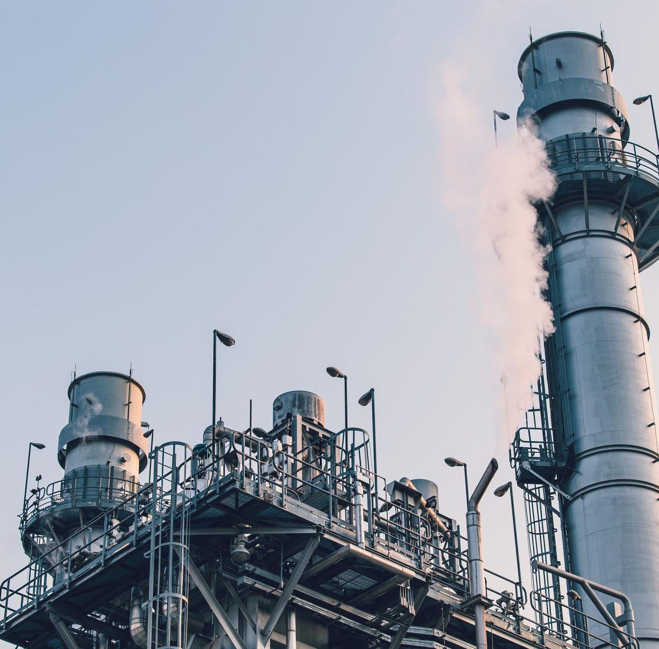 power-station-clean-modern-factory-petroleum-petrochemical-industry-building-outdoors-landscape-with-large-chimney-releasing-smoke